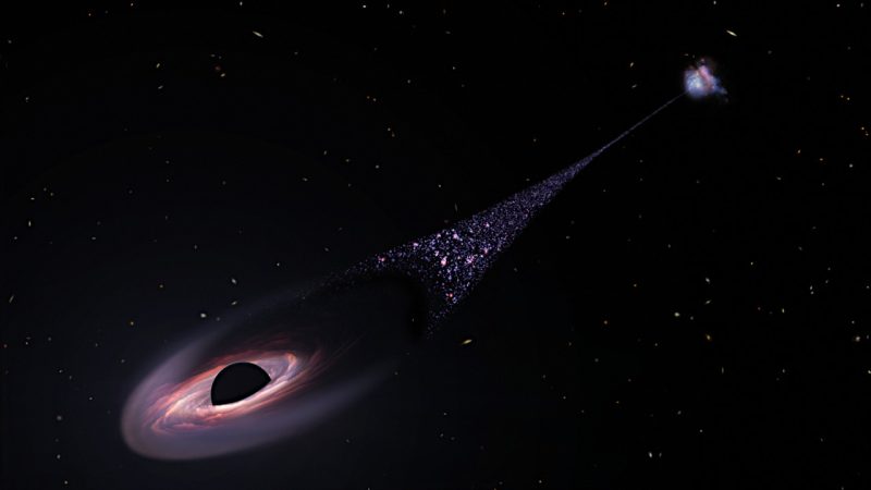 高速で移動しつつ星々の「航跡」を残す超大質量ブラックホールの想像図。Image Credit: NASA, ESA, Leah Hustak (STScI)